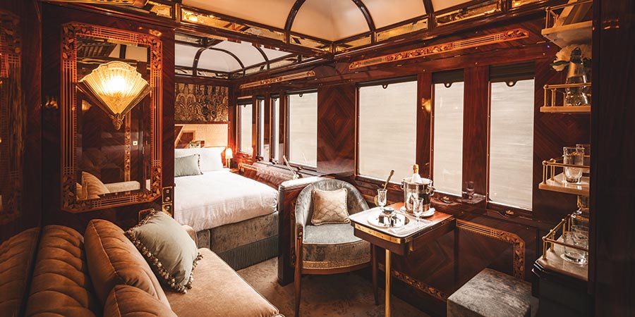 A decadent suite onboard the train: this suite includes a sofa, ornate decorations and even a personal bar for the customer. 